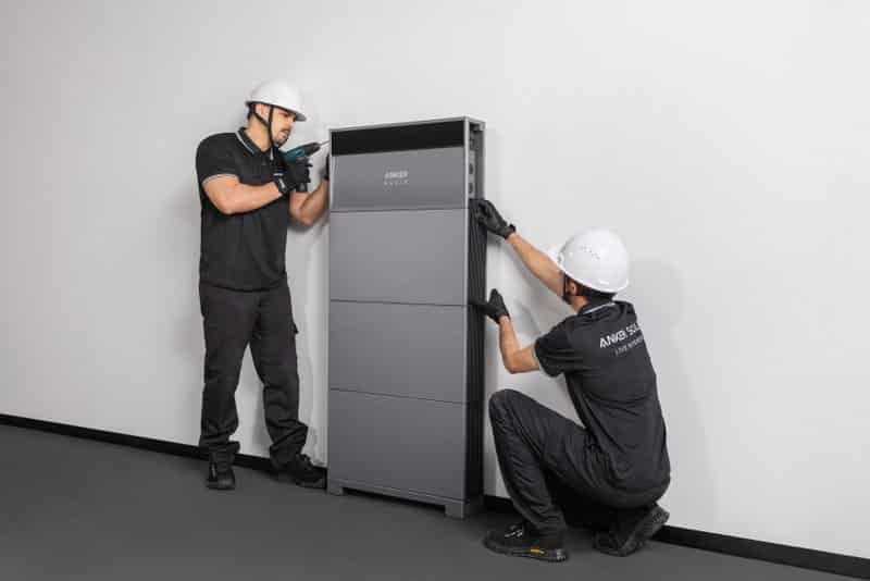 A modular home battery system installed neatly on a utility room wall.